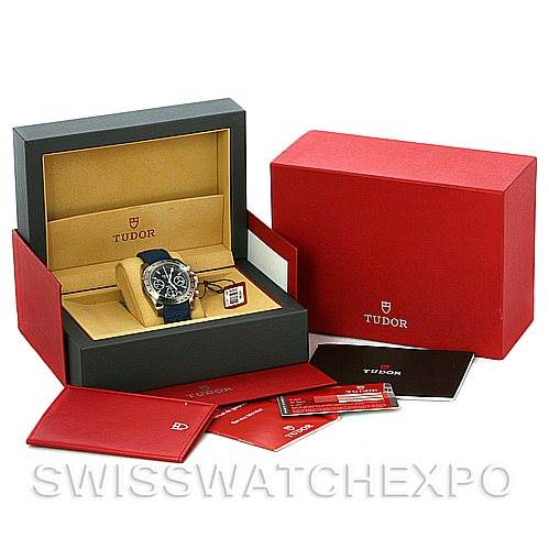 The image shows a Tudor Sport Chronograph 20300 Men's Stainless Steel Black Dial 20300 Men's Stainless Steel Black Dial watch in its box, with accompanying packaging and documentation displayed around it.