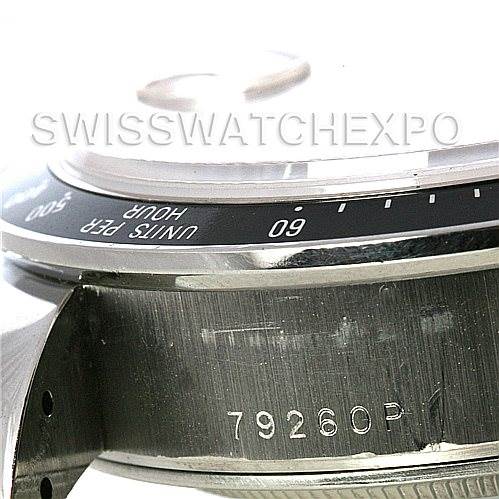 This close-up of the Tudor Tiger 79260 Men's Stainless Steel Red Dial 79260 Men's Stainless Steel Red Dial model watch shows part of the bezel, case, and the etched reference number 79260P.