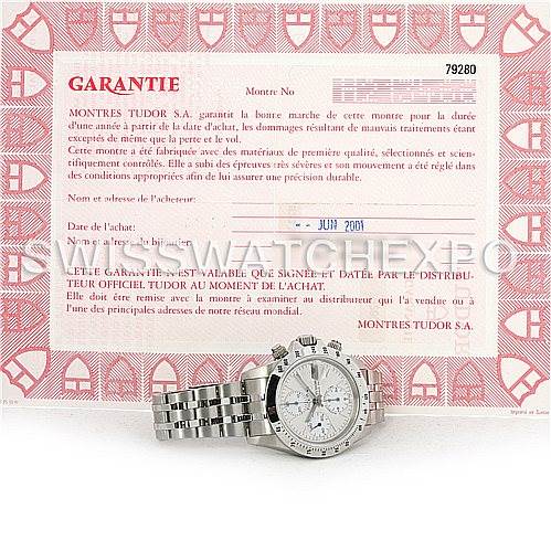 The image shows a Tudor Prince model watch front view with its warranty certificate in the background.