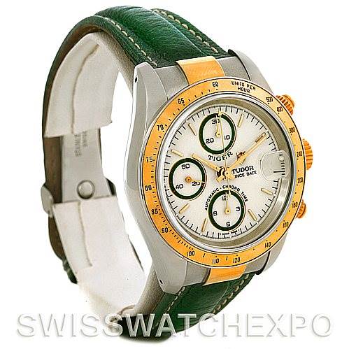 The image shows a Tudor Tiger 79263 Men's Steel and Gold (two tone) White Dial 79263 Men's Steel and Gold (two tone) White Dial model watch at an angle highlighting the face, green leather strap, and gold-tone bezel and crown.