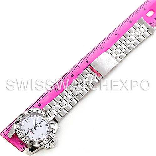 The Tudor Hydronaut 20020 Men's Stainless Steel White Dial 20020 Men's Stainless Steel White Dial watch is shown fully extended beside a ruler, highlighting its face, bezel, and metal bracelet.