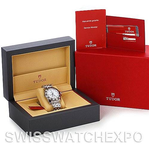 The image shows the Tudor Hydronaut 20020 Men's Stainless Steel White Dial 20020 Men's Stainless Steel White Dial watch at an angle inside its open box, alongside warranty booklets and a red outer box.