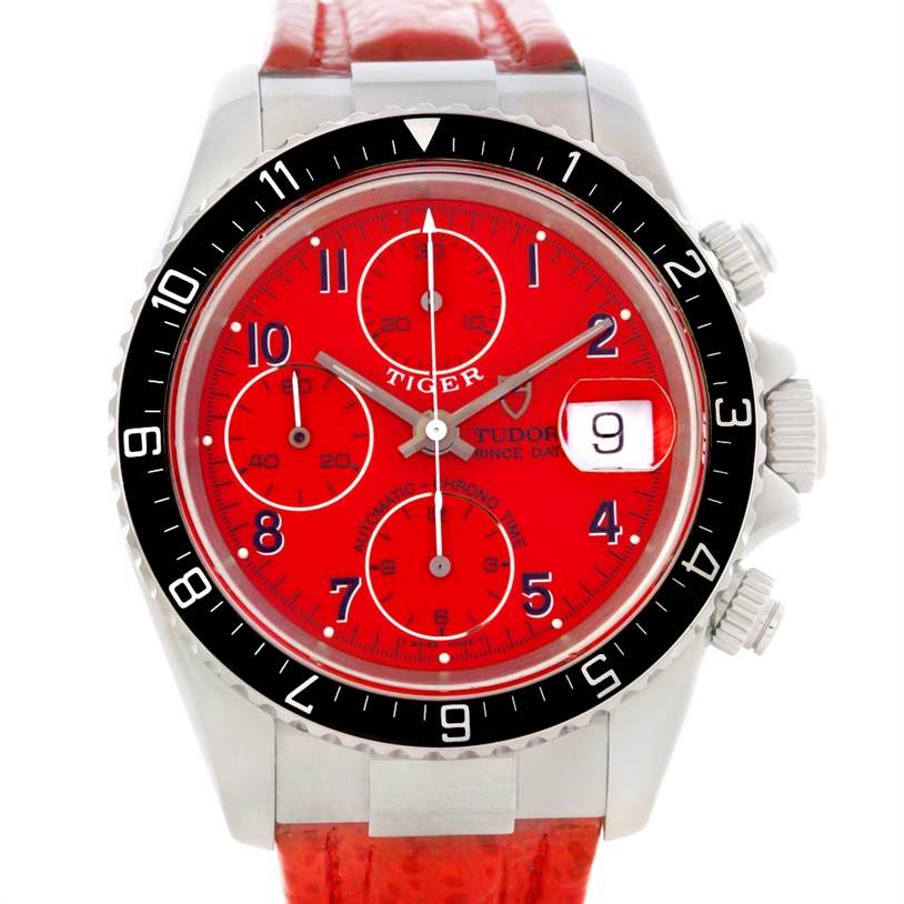 The image shows a Tudor Tiger 79270 Men's Stainless Steel Red Dial 79270 Men's Stainless Steel Red Dial model watch face, highlighting its red dial, chronograph subdials, bezel, and side crown buttons.
