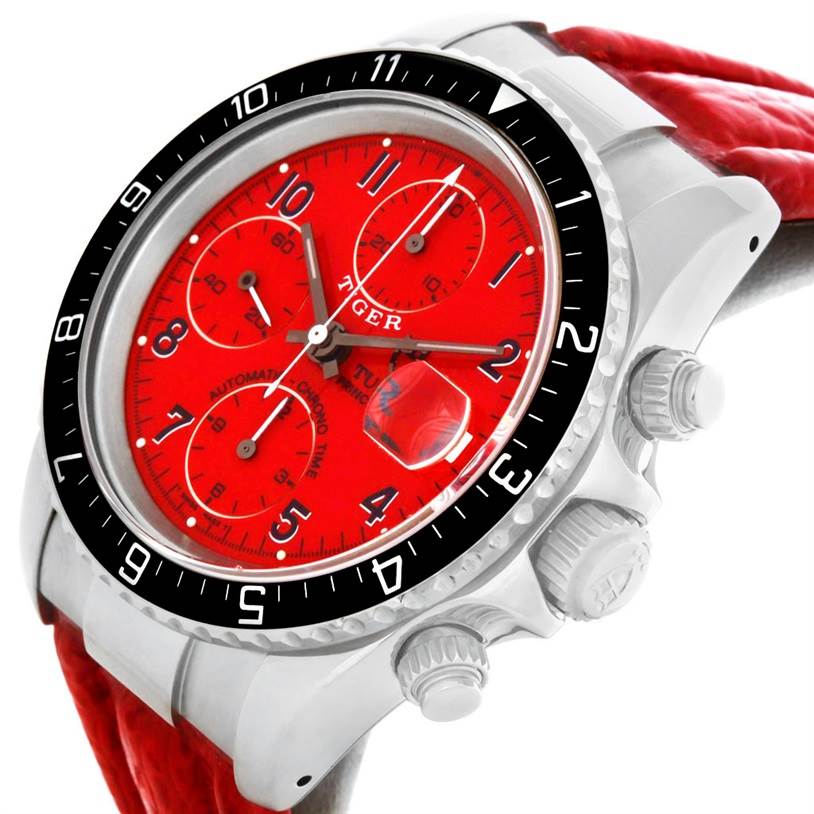 The image shows a close-up angled view of the Tudor Tiger 79270 Men's Stainless Steel Red Dial 79270 Men's Stainless Steel Red Dial model watch, highlighting its red dial, bezel, and side buttons.