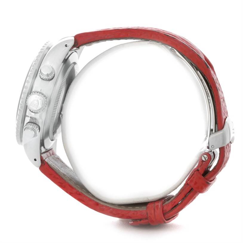 This side view of the Tudor Tiger 79270 Men's Stainless Steel Red Dial 79270 Men's Stainless Steel Red Dial watch shows the crown, pushers, and a red strap.