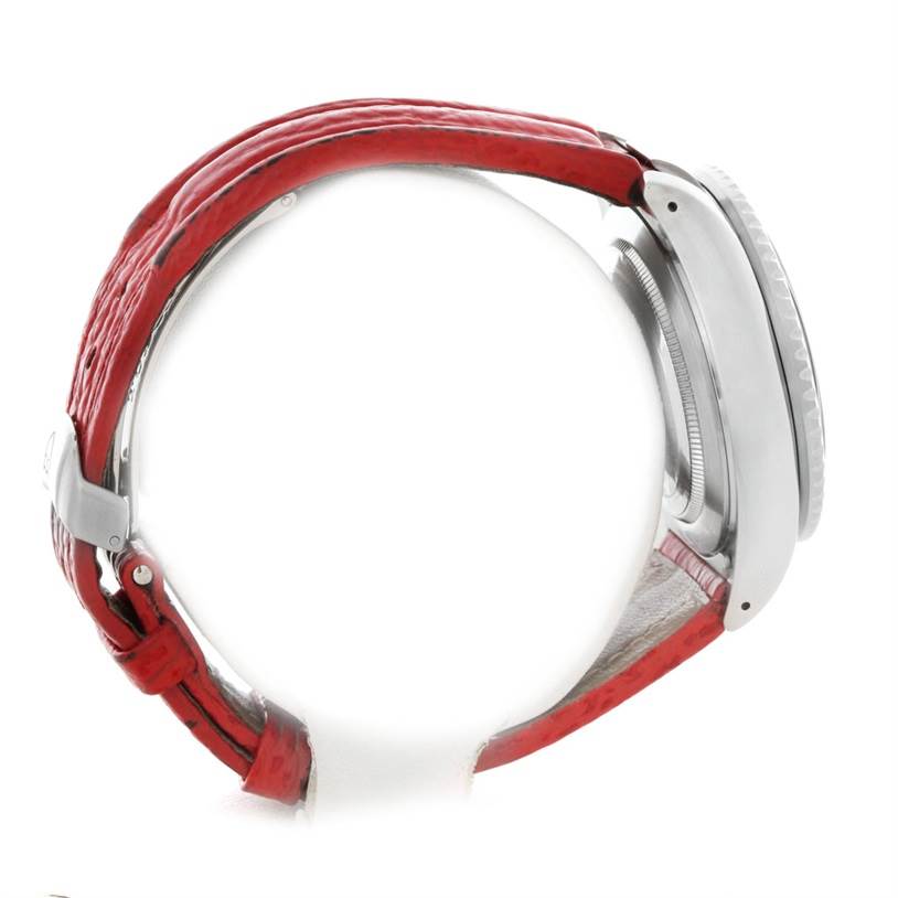 The image shows a side view of the Tudor Tiger 79270 Men's Stainless Steel Red Dial 79270 Men's Stainless Steel Red Dial watch, highlighting its red strap and case details.