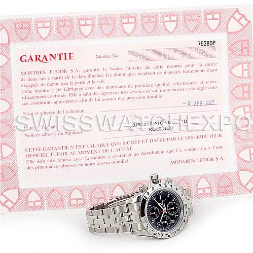 The image shows a Tudor Prince 79280 Men's Stainless Steel Black Dial 79280 Men's Stainless Steel Black Dial model watch at an angle alongside its warranty certificate.