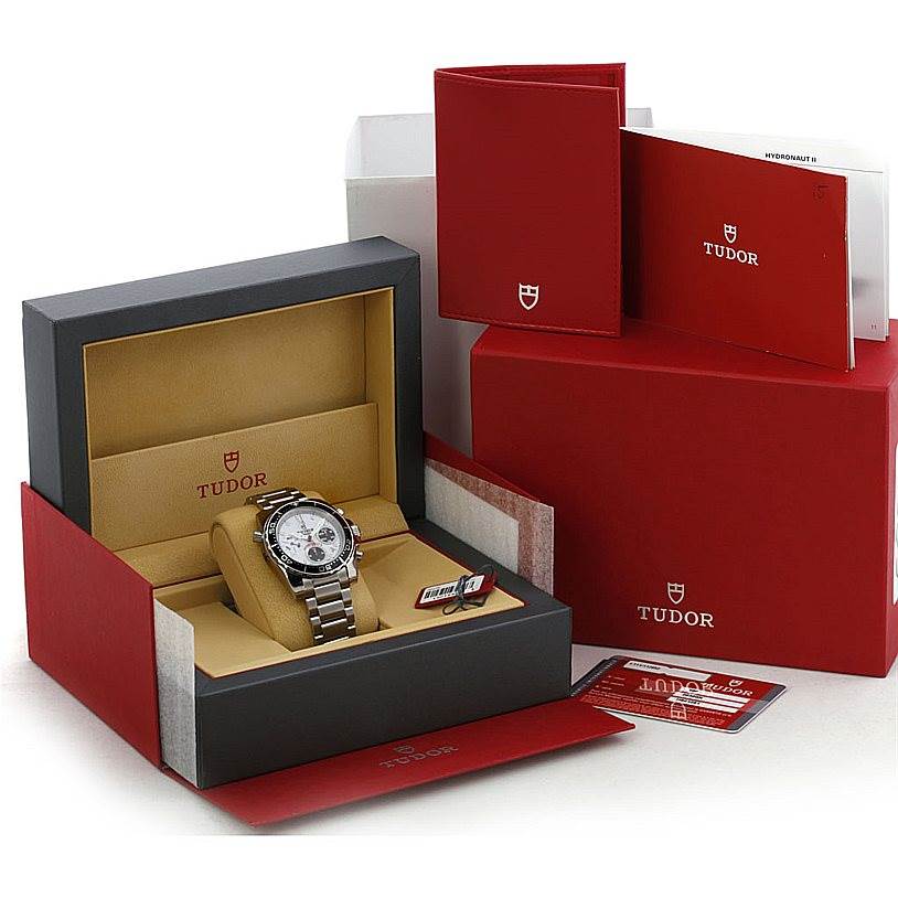 The image shows a Tudor Hydronaut 20360N Men's Stainless Steel White Dial 20360N Men's Stainless Steel White Dial watch at an angle inside its open box with accompanying documentation and packaging.