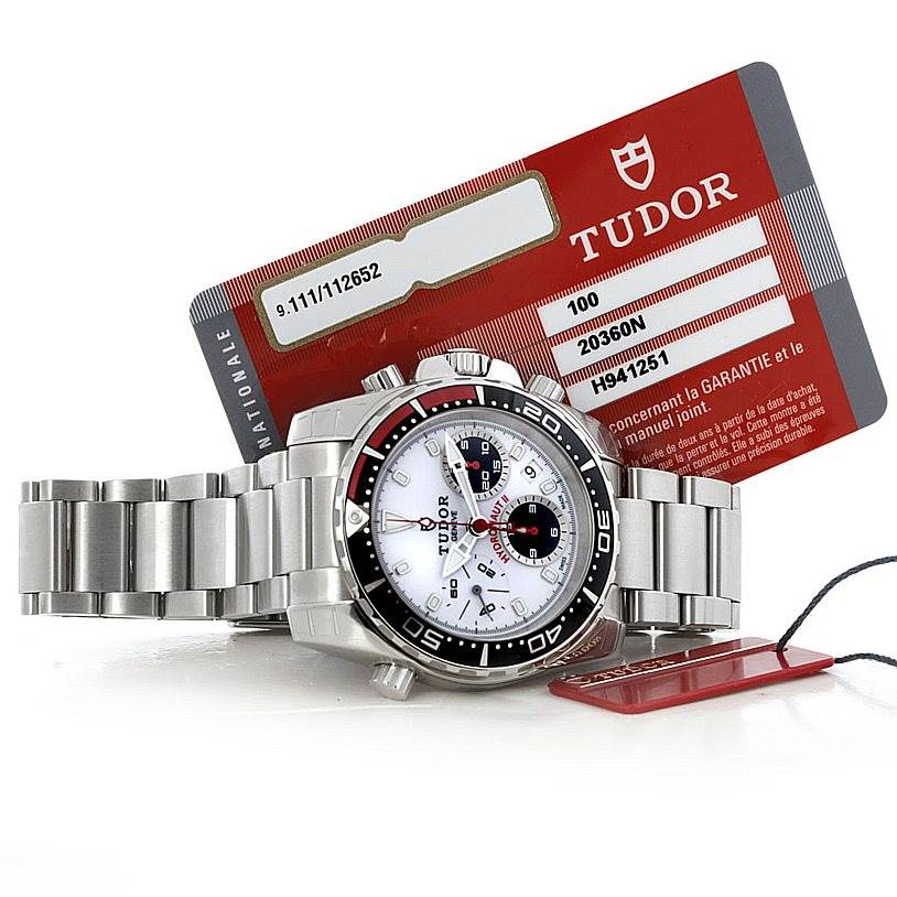 The image shows a Tudor Hydronaut 20360N Men's Stainless Steel White Dial 20360N Men's Stainless Steel White Dial watch from a front angle, alongside warranty cards and tags.