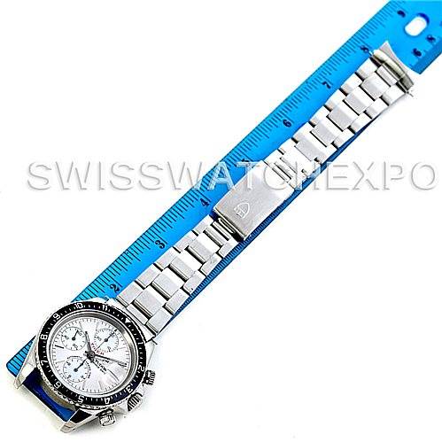 The image shows a full top view of a Tudor Tiger 79270 Men's Stainless Steel Silver Dial 79270 Men's Stainless Steel Silver Dial wristwatch, including its bezel, dial, and stainless steel bracelet alongside a ruler.