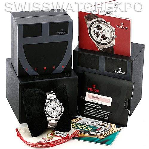 The image shows a Tudor Tiger 79270 Men's Stainless Steel Silver Dial 79270 Men's Stainless Steel Silver Dial model watch, its box, manual, warranty card, and additional accessories from an overhead angle.