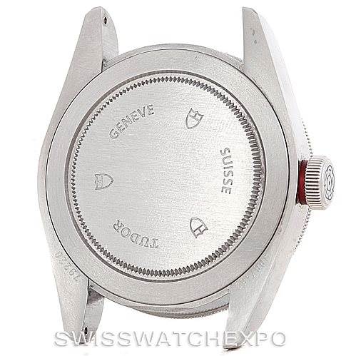 The image shows the case back and crown of a Tudor Heritage Black Bay 79220R Men
s Stainless Steel Black Dial 79220R Men
s Stainless Steel Black Dial watch, viewed from the back.