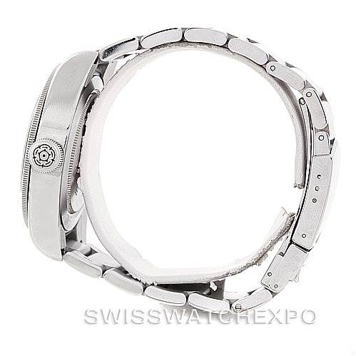 This image shows a side view of the Tudor Heritage Black Bay 79220R Men
s Stainless Steel Black Dial 79220R Men
s Stainless Steel Black Dial watch, highlighting its case, crown, and metal bracelet.