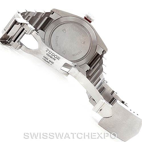 The image shows the backside and clasp of a Tudor Heritage Black Bay 79220R Men
s Stainless Steel Black Dial 79220R Men
s Stainless Steel Black Dial watch, highlighting its stainless steel bracelet and case back.