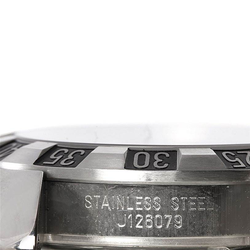 This image shows a close-up side view of the bezel and serial number of the Tudor Hydronaut 20040 Men
s Stainless Steel Black Dial 20040 Men
s Stainless Steel Black Dial watch.