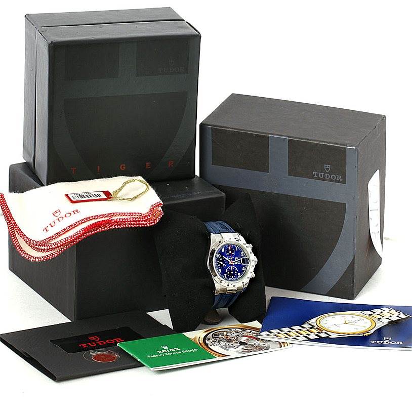 The image shows a Tudor Tiger 79280 Men's Stainless Steel Blue Dial 79280 Men's Stainless Steel Blue Dial model watch with original packaging, manuals, and accessories from a slightly elevated angle.