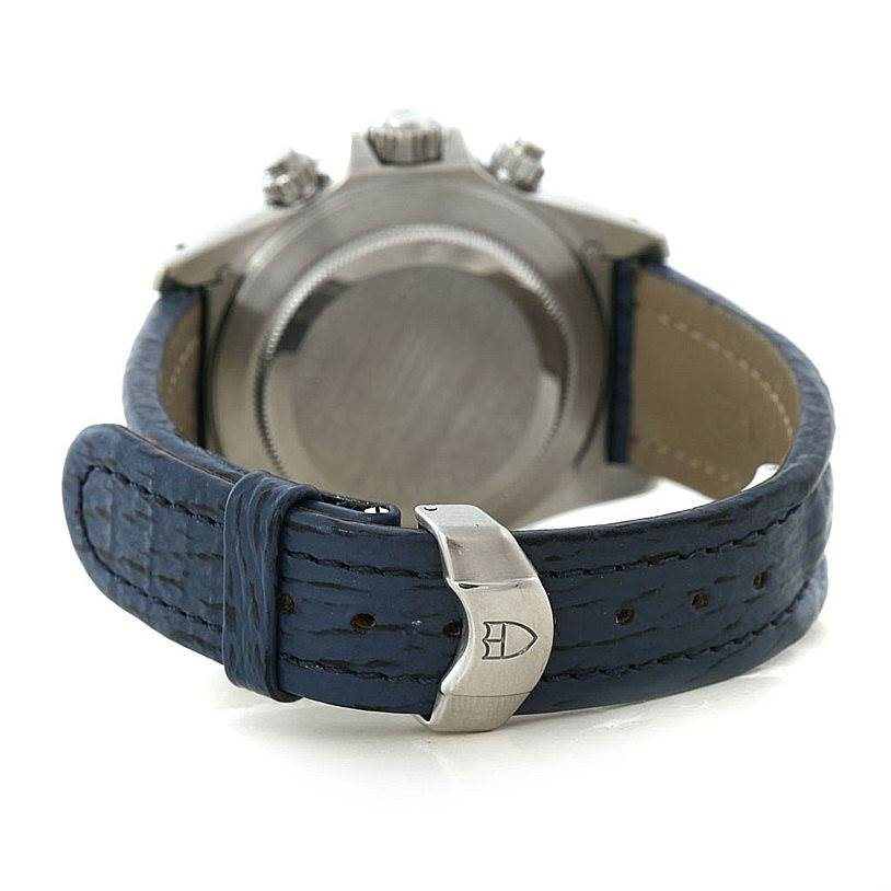 The image shows the rear view of a Tudor Tiger 79280 Men's Stainless Steel Blue Dial 79280 Men's Stainless Steel Blue Dial model watch, featuring the case back, crown, pushers, and blue leather strap with a buckle.
