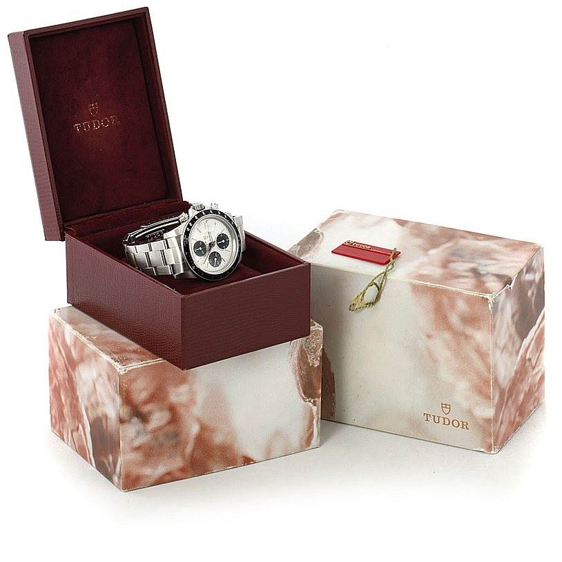 The Tudor Tiger 79260 Men's Stainless Steel Silver Dial 79260 Men's Stainless Steel Silver Dial watch is displayed at a three-quarter angle, placed inside an open maroon box, with another box beside it.