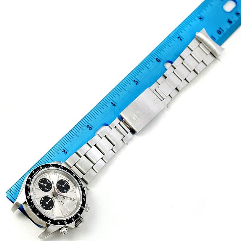 The image shows the Tudor Tiger 79260 Men's Stainless Steel Silver Dial 79260 Men's Stainless Steel Silver Dial model watch laid flat with a ruler, displaying the watch face, bezel, and metal bracelet.