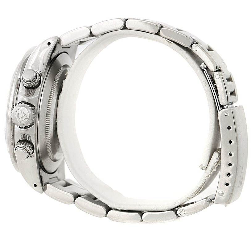 The image shows a side view of the Tudor Tiger 79260 Men's Stainless Steel Silver Dial 79260 Men's Stainless Steel Silver Dial watch, displaying its crown, pushers, and metallic bracelet with holes for adjustment.