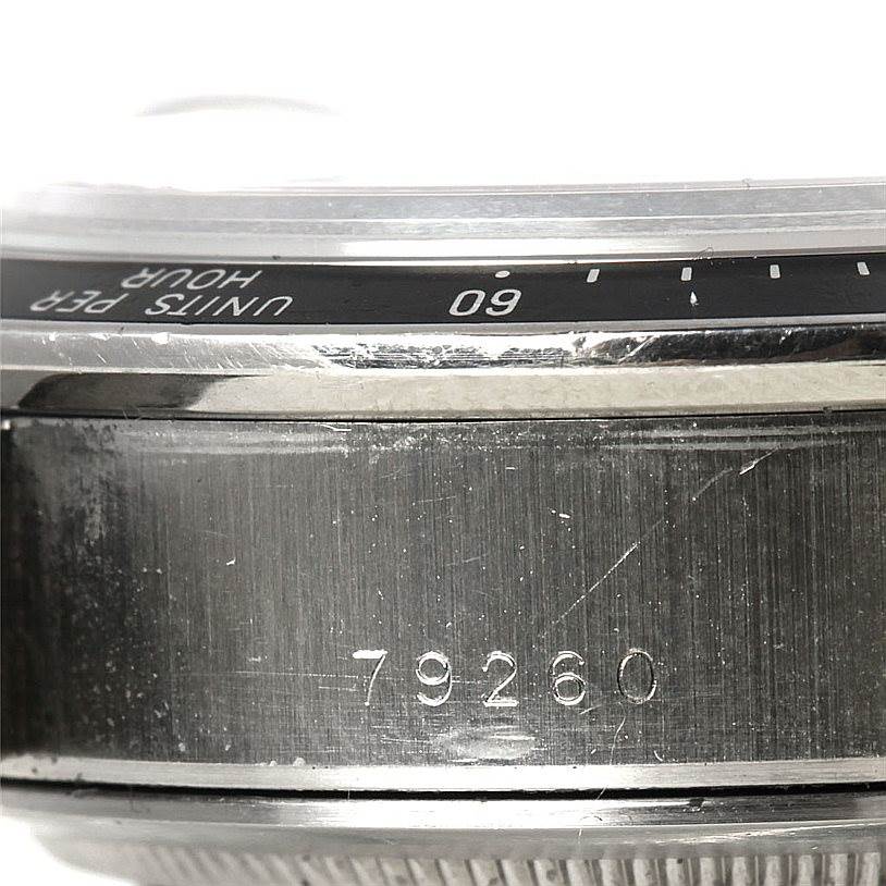 This close-up image of the Tudor Tiger 79260 Men's Stainless Steel Silver Dial 79260 Men's Stainless Steel Silver Dial model 79260 shows the side profile of the watch case and part of the bezel.