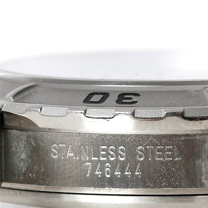 The image shows the stainless steel bezel and edge of the dial of a Tudor Hydronaut 89190 Men's Stainless Steel Beige Dial 89190 Men's Stainless Steel Beige Dial watch, displaying part of the 30-minute marker.