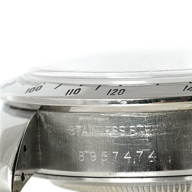 A close-up view of the bezel and stainless steel case side of a Tudor Tiger 79280P Men's Stainless Steel Black Dial 79280P Men's Stainless Steel Black Dial model watch, showing the engraving and part of the lug.