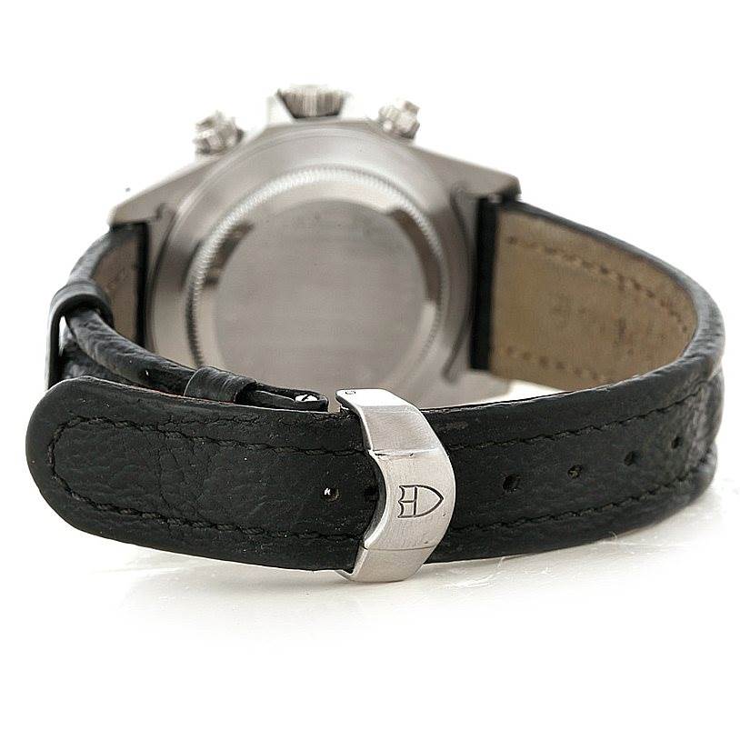 The Tudor Tiger 79280P Men's Stainless Steel Black Dial 79280P Men's Stainless Steel Black Dial model watch is shown from the rear, highlighting the case back and black leather strap with the Tudor logo on the clasp.