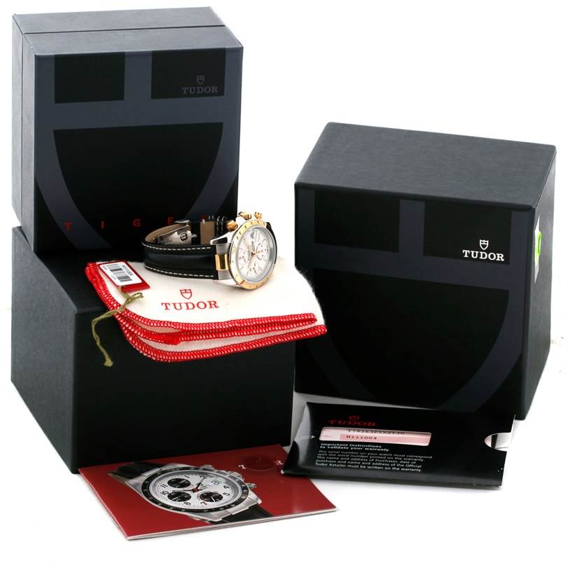 The image shows a Tudor Tiger 79263 Men's Steel and Gold (two tone) White Dial 79263 Men's Steel and Gold (two tone) White Dial watch at an angle that displays the dial, with its box, manual, cleaning cloth, and tag.