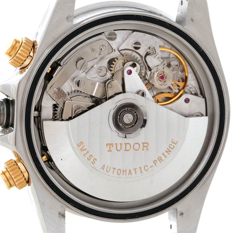 The image shows the back view of a Tudor Tiger 79263 Men's Steel and Gold (two tone) White Dial 79263 Men's Steel and Gold (two tone) White Dial model watch, highlighting its intricate automatic movement.
