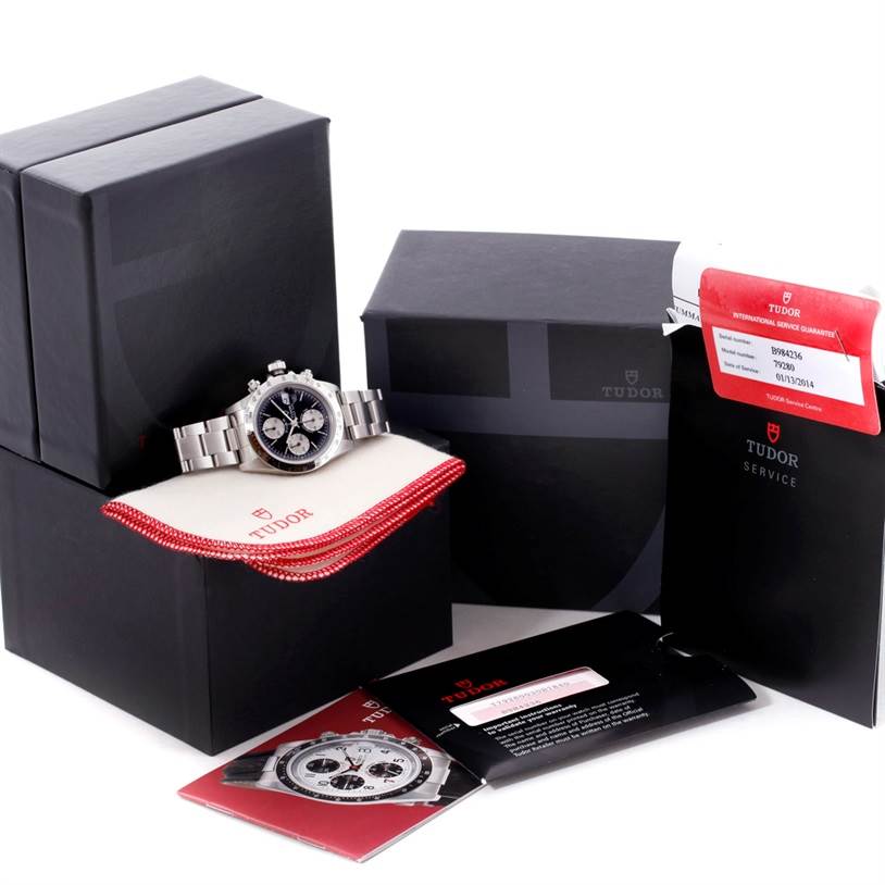 This image shows the Tudor Prince model watch and its accessories from a three-quarter frontal angle with boxes, pouch, and guarantee card.