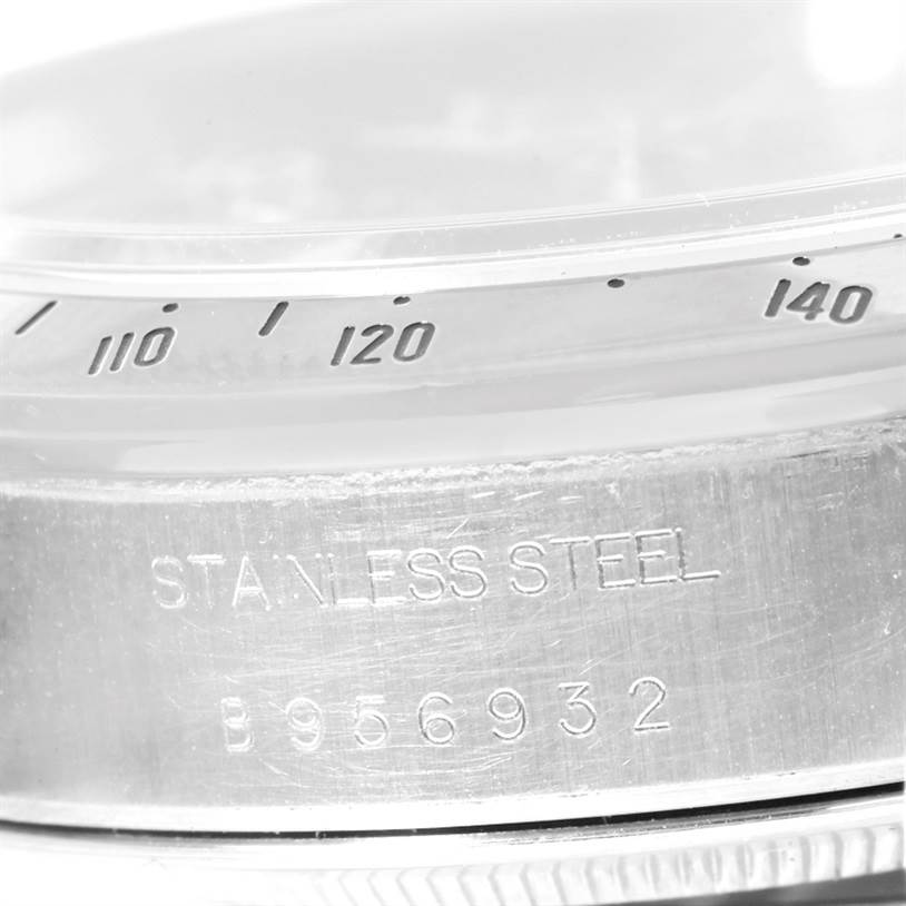 This close-up image shows the side of the bezel and case back of the Tudor Tiger 79280 Men's Stainless Steel Green Dial 79280 Men's Stainless Steel Green Dial model watch, featuring the serial number and material.