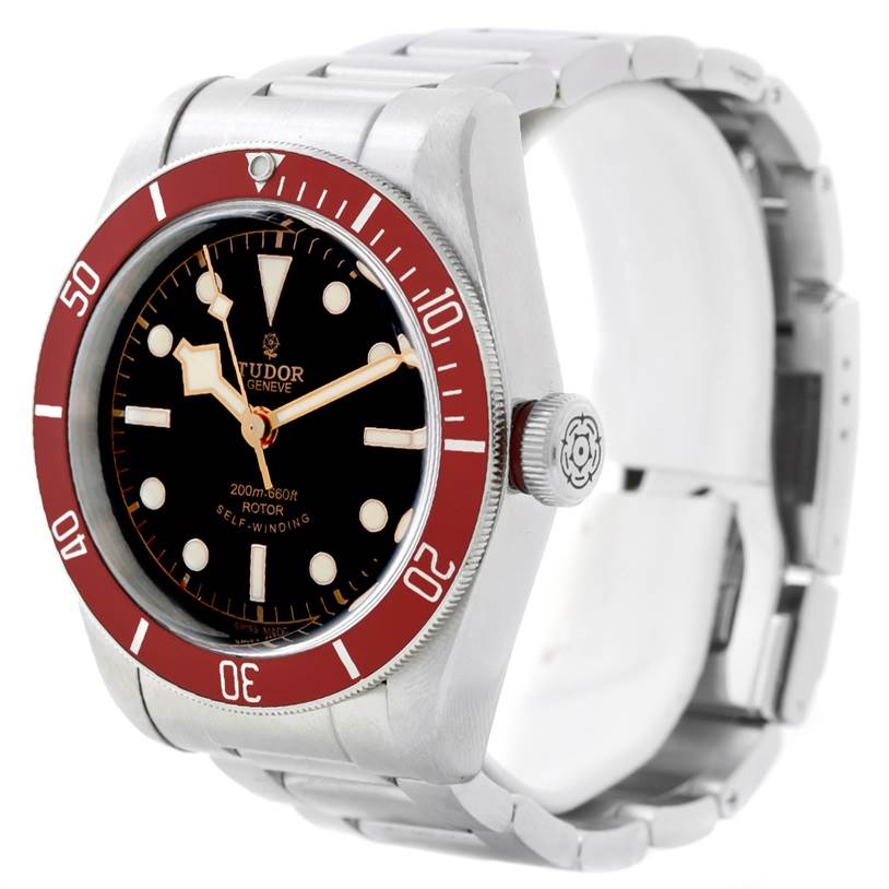 The image shows a Tudor Heritage Black Bay 79220 Men
s Stainless Steel Black Dial 79220 Men
s Stainless Steel Black Dial watch at an angle highlighting the case, bezel, dial, and bracelet.