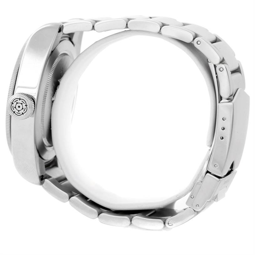 The image shows a side profile of the Tudor Heritage Black Bay 79220 Men
s Stainless Steel Black Dial 79220 Men
s Stainless Steel Black Dial watch, focusing on its case, crown, and bracelet.