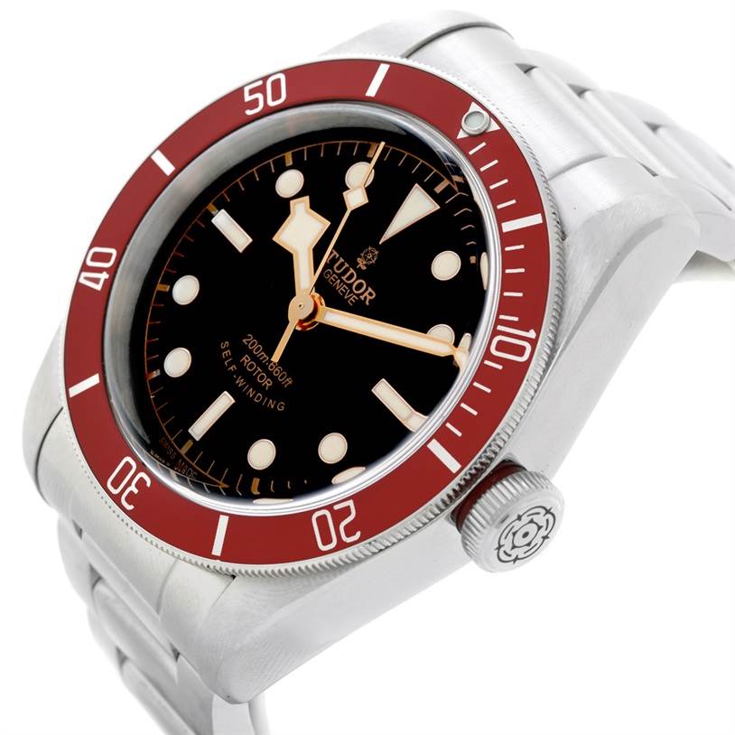 This image shows a close-up, angled view of the Tudor Heritage Black Bay 79220 Men
s Stainless Steel Black Dial 79220 Men
s Stainless Steel Black Dial watch, highlighting its face, bezel, and crown.