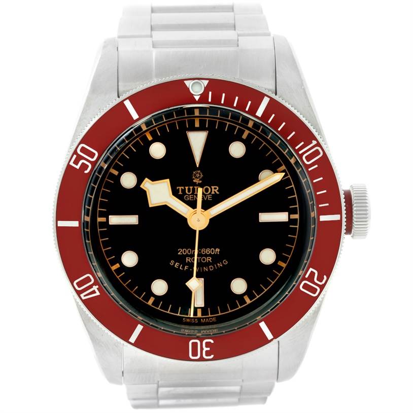 The image shows a front view of a Tudor Heritage Black Bay 79220 Men
s Stainless Steel Black Dial 79220 Men
s Stainless Steel Black Dial watch with a red bezel and stainless steel bracelet.