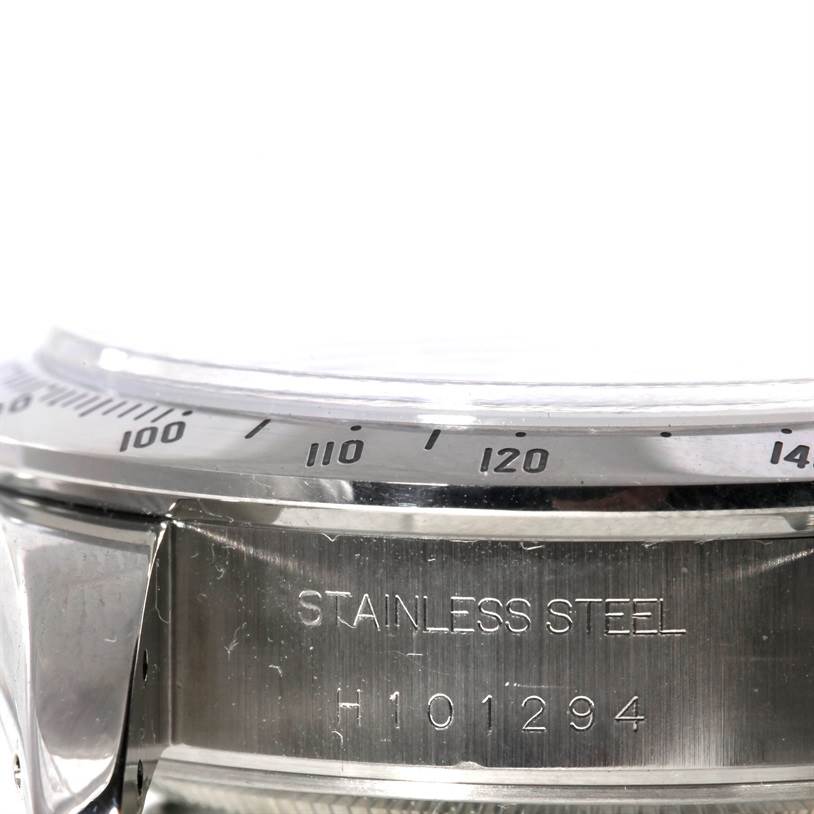 The image shows the side angle of the bezel and case back of a Tudor Tiger 79280 Men's Stainless Steel Blue Dial 79280 Men's Stainless Steel Blue Dial model watch, highlighting the stainless steel engraving and serial number.