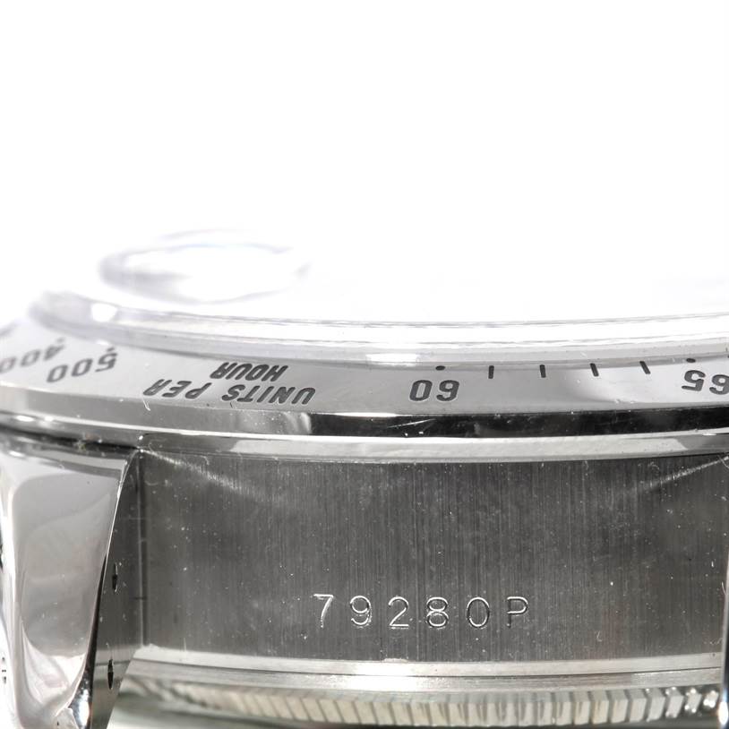 This image shows a close-up side view of the bezel and the case back, including a serial number, of the Tudor Tiger 79280 Men's Stainless Steel Blue Dial 79280 Men's Stainless Steel Blue Dial model watch.