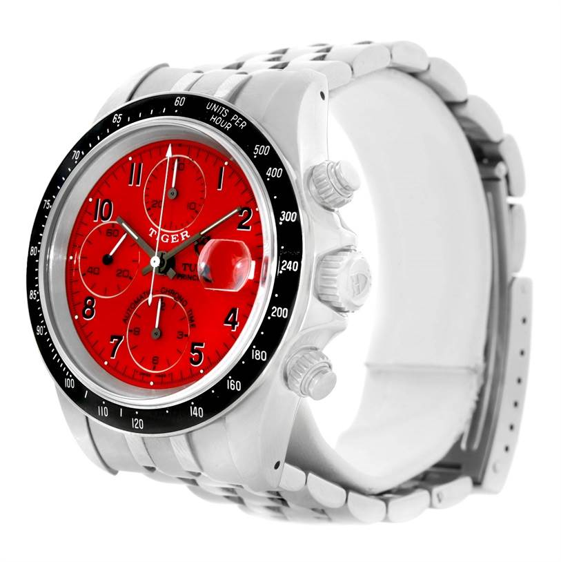 The image shows a side angle of a Tudor Prince watch, highlighting its red dial, bezel, crown, and pushers.