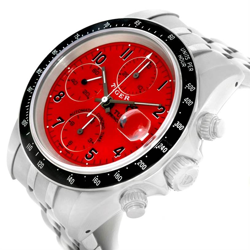 The image shows a Tudor Prince model watch viewed from a slight front angle, highlighting the red dial, chronograph subdials, and bezel.