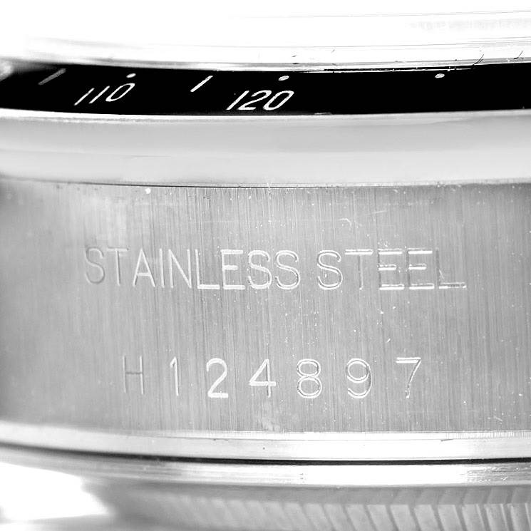This image shows a close-up of the serial number and stainless steel engraving on the casing of a Tudor Prince model watch.