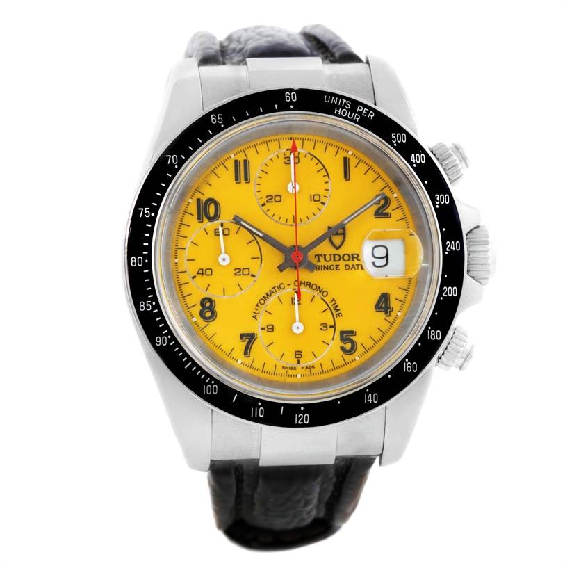 The photo shows a frontal view of a Tudor Prince model watch featuring a yellow dial, black bezel, chronograph, and date display.