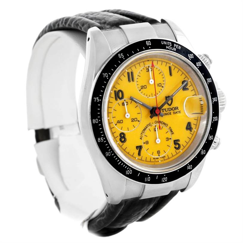The image shows a Tudor Prince model watch angled to display the yellow dial, black bezel, and leather strap.