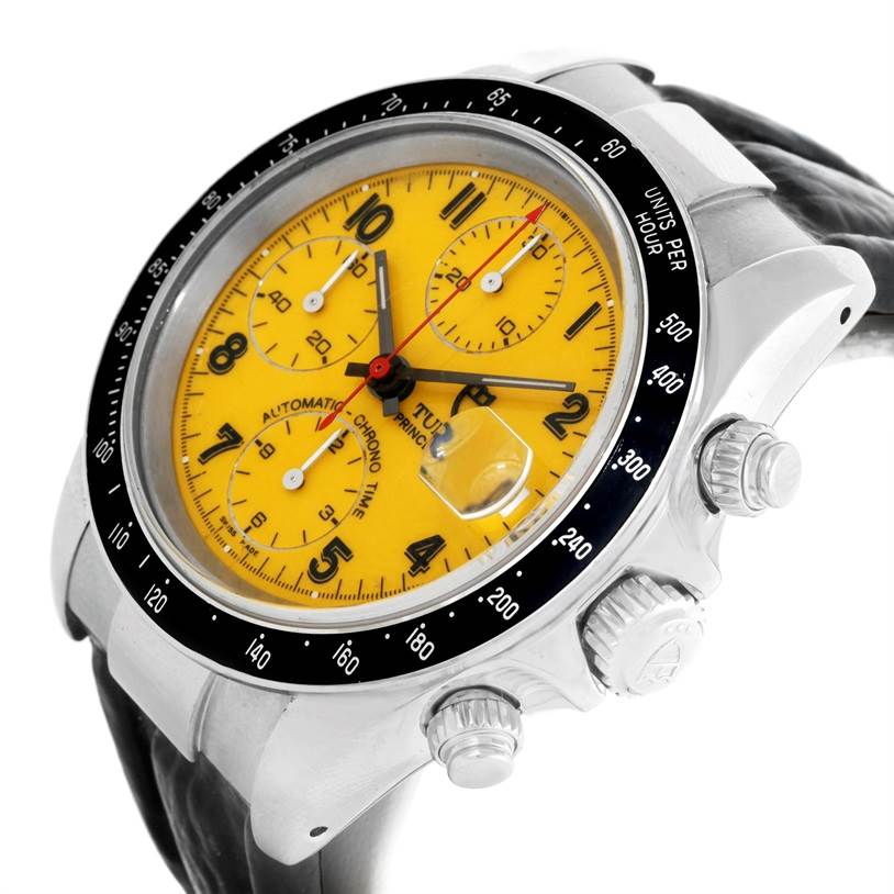 The Tudor Prince watch is shown at a slight angle, highlighting the yellow face, chronograph dials, bezel, and crown.