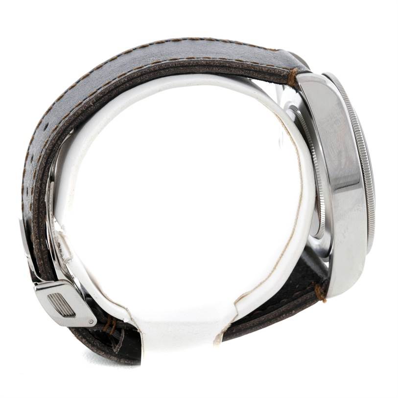 The image shows a side view of the Tudor Heritage Black Bay 79220R Men's Stainless Steel Black Dial 79220R Men's Stainless Steel Black Dial watch, highlighting its case and leather strap.