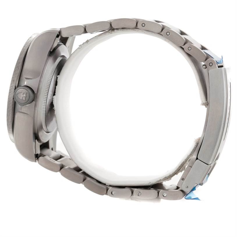 The image shows a side view of the Tudor Pelagos 25500TN Men
s Titanium Black Dial 25500TN Men
s Titanium Black Dial watch, highlighting its case, crown, and metal bracelet.