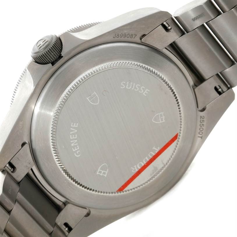 This image shows the back case of the Tudor Pelagos 25500TN Men
s Titanium Black Dial 25500TN Men
s Titanium Black Dial watch at an angle, highlighting the case back and part of the stainless steel bracelet.