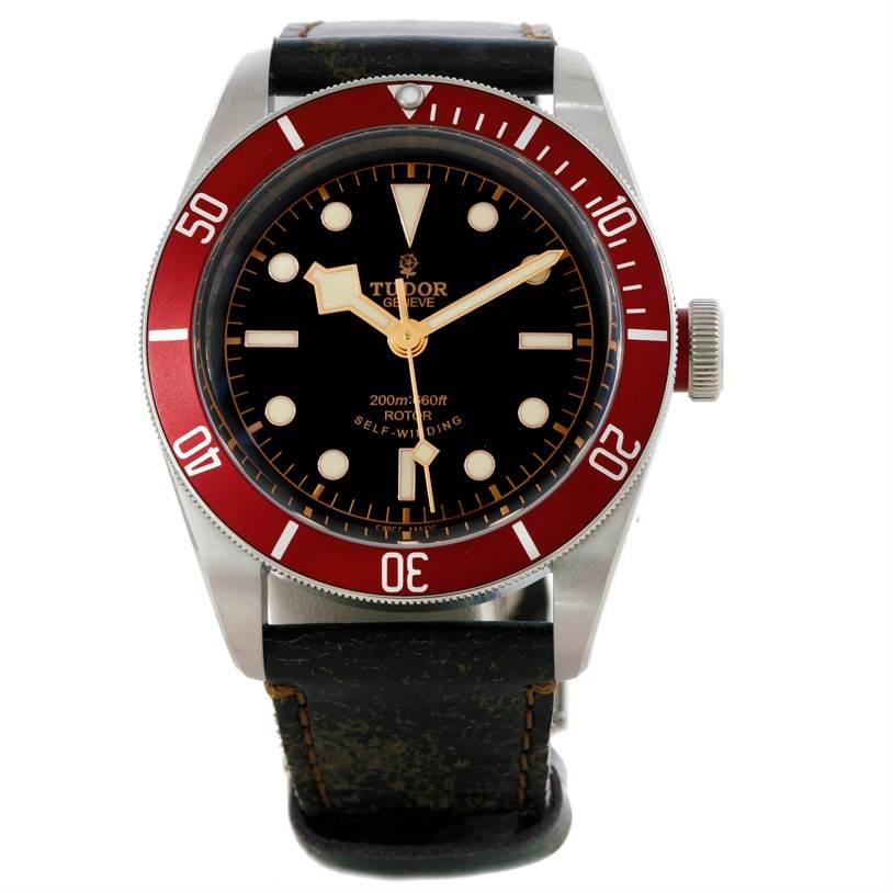 This is a front view of the Tudor Heritage Black Bay 79220R Men's Stainless Steel Black Dial 79220R Men's Stainless Steel Black Dial watch showing the dial, bezel, hands, and the strap.