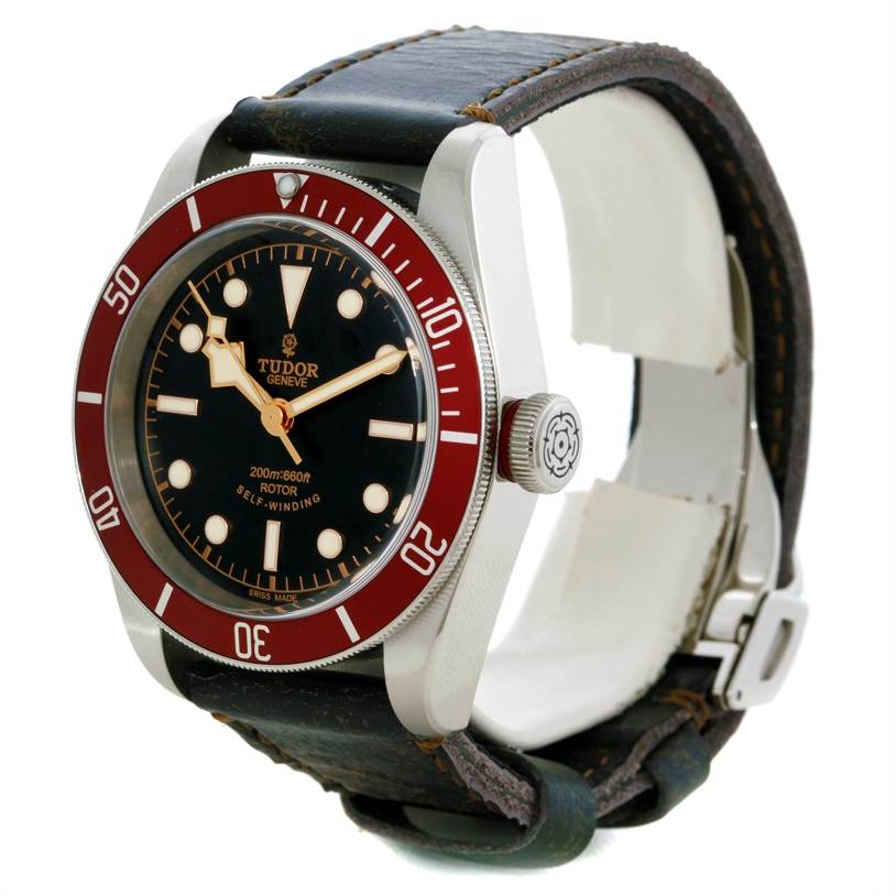 The Tudor Heritage Black Bay 79220R Men's Stainless Steel Black Dial 79220R Men's Stainless Steel Black Dial watch is shown at a slight angle, highlighting the face, bezel, crown, and leather strap.