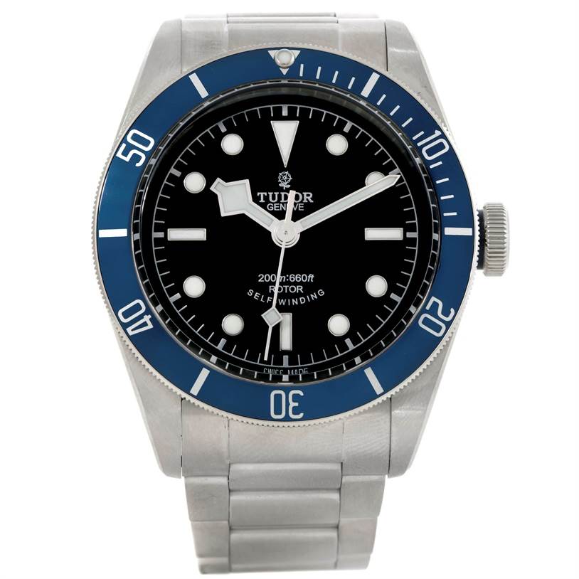 The image shows a front view of a Tudor Heritage Black Bay 79220 Men's Stainless Steel Black Dial 79220 Men's Stainless Steel Black Dial watch, highlighting the dial, bezel, crown, and stainless steel bracelet.